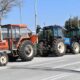 a group of tractors parked on a street