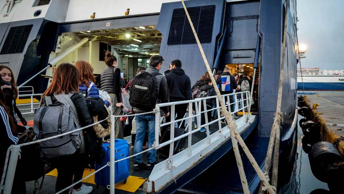 a group of people boarding a boat