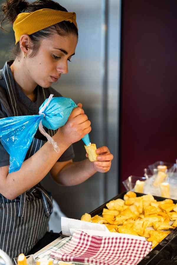 a person's hands on a plate of food