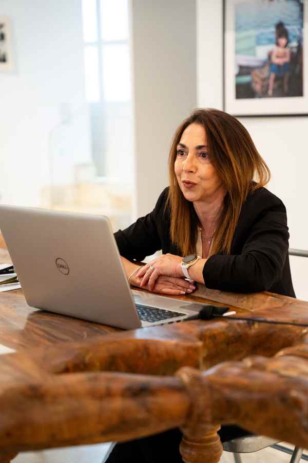 a man sitting at a table with a microphone