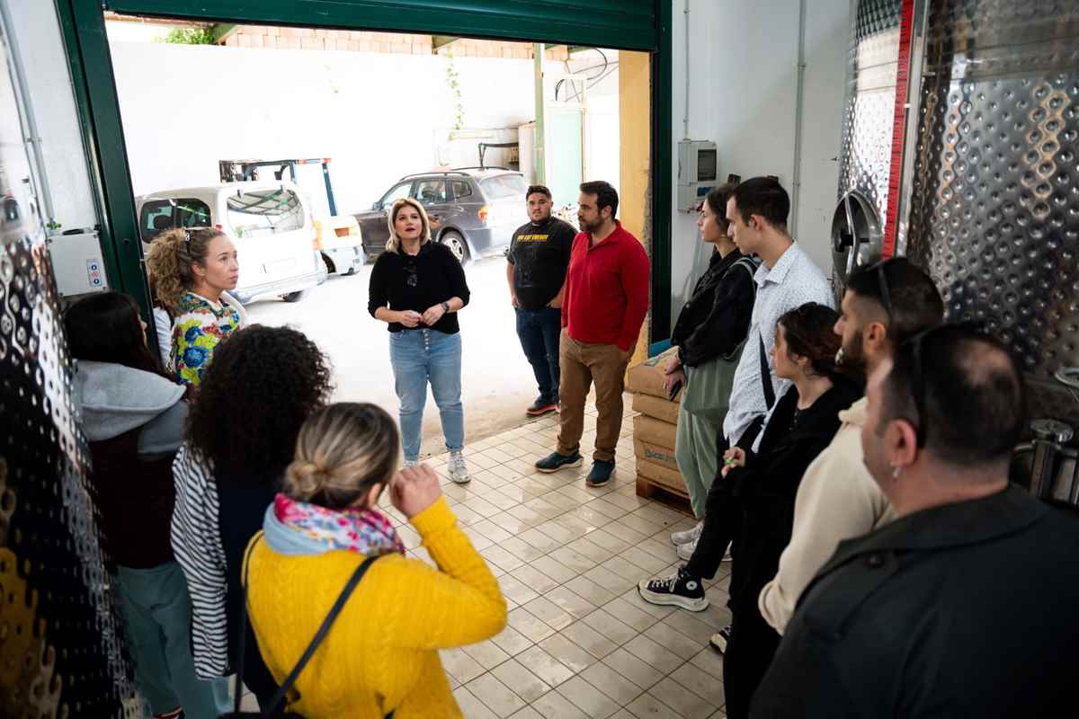 a group of people standing in a garage