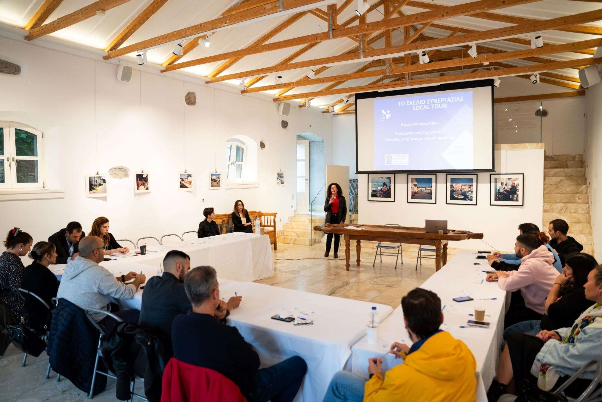 a woman giving a presentation to a group of people