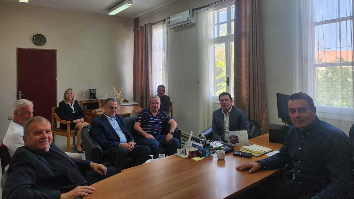 a group of people sitting around a table