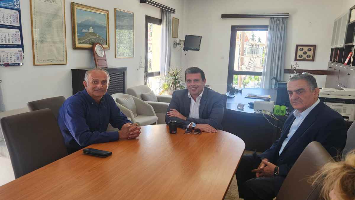 a group of men sitting at a table
