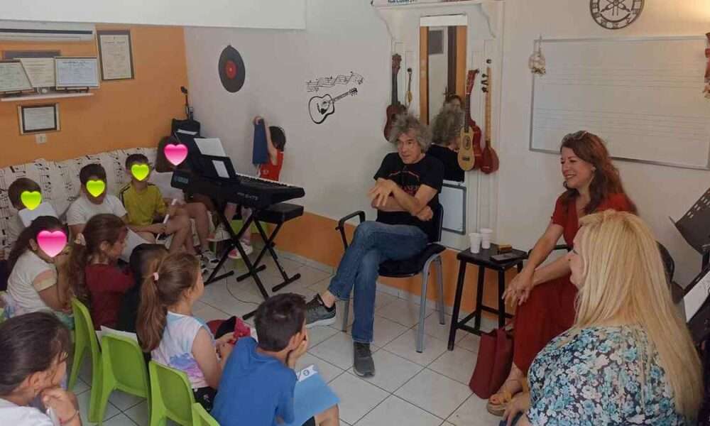 a basketball player in a green uniform with a ball in the air