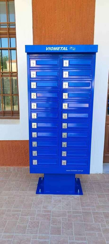 a blue mailboxes on a wall
