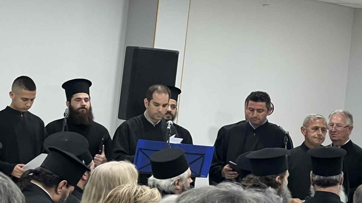 a group of men wearing black robes and hats