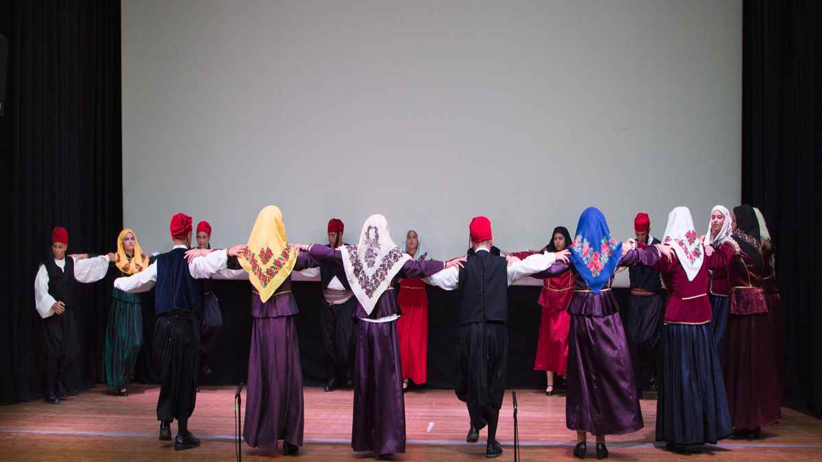 a group of people wearing headscarves on a stage