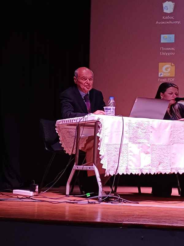 a man sitting at a table with a laptop