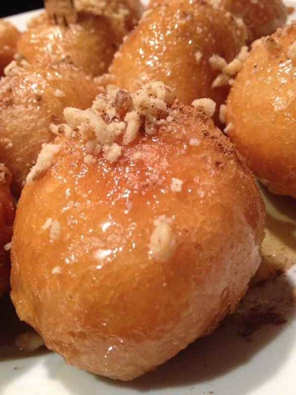 a group of drinks in mason jars with straws