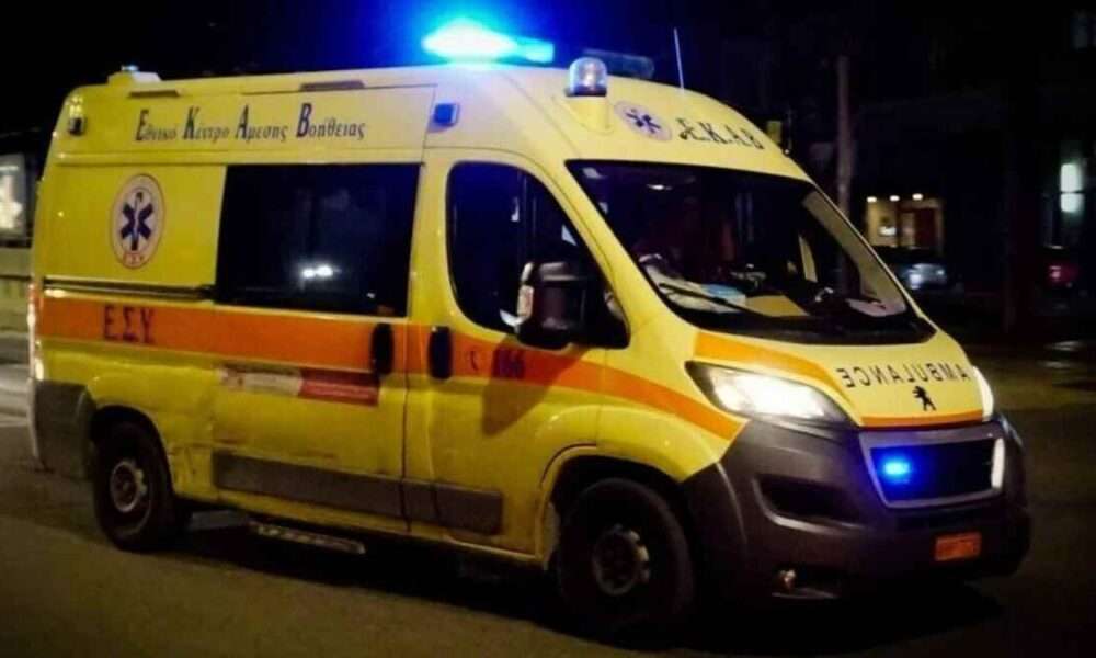 a yellow and orange ambulance with blue lights on top