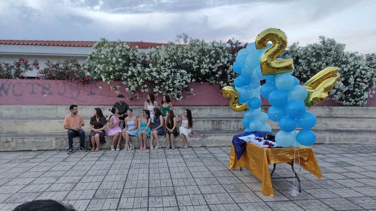 a group of people sitting on a bench