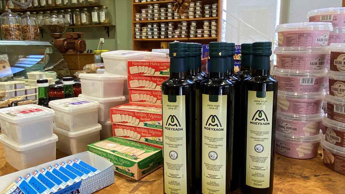 a shelf with plastic containers of food