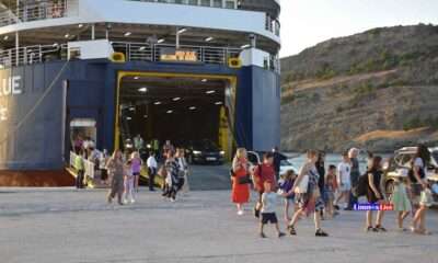 a group of people walking on a dock