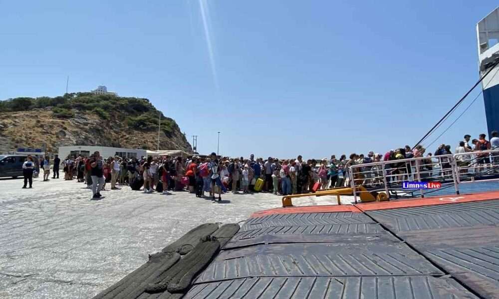 a group of people standing on a dock