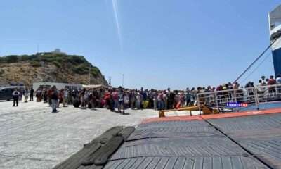 a group of people standing on a dock