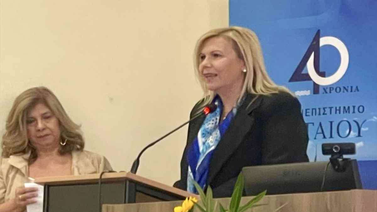 a woman speaking into a microphone