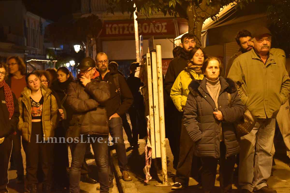 a group of people standing on a street