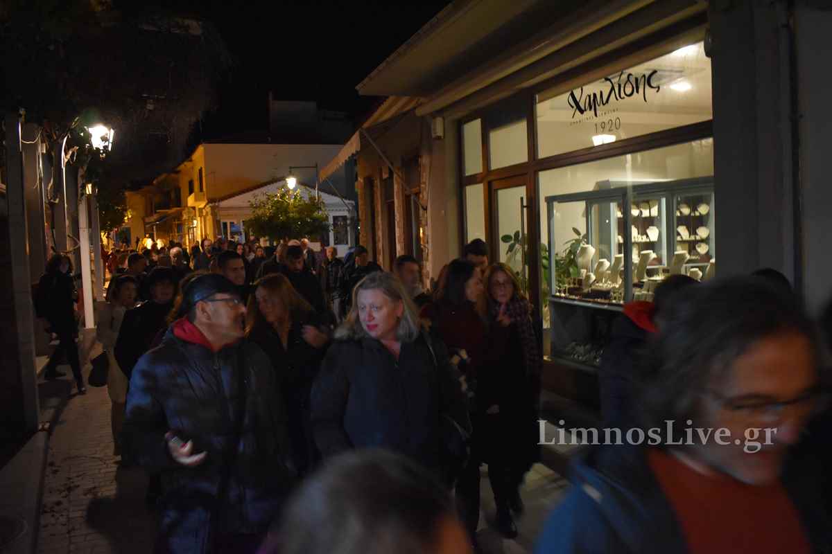 a group of people walking down a street