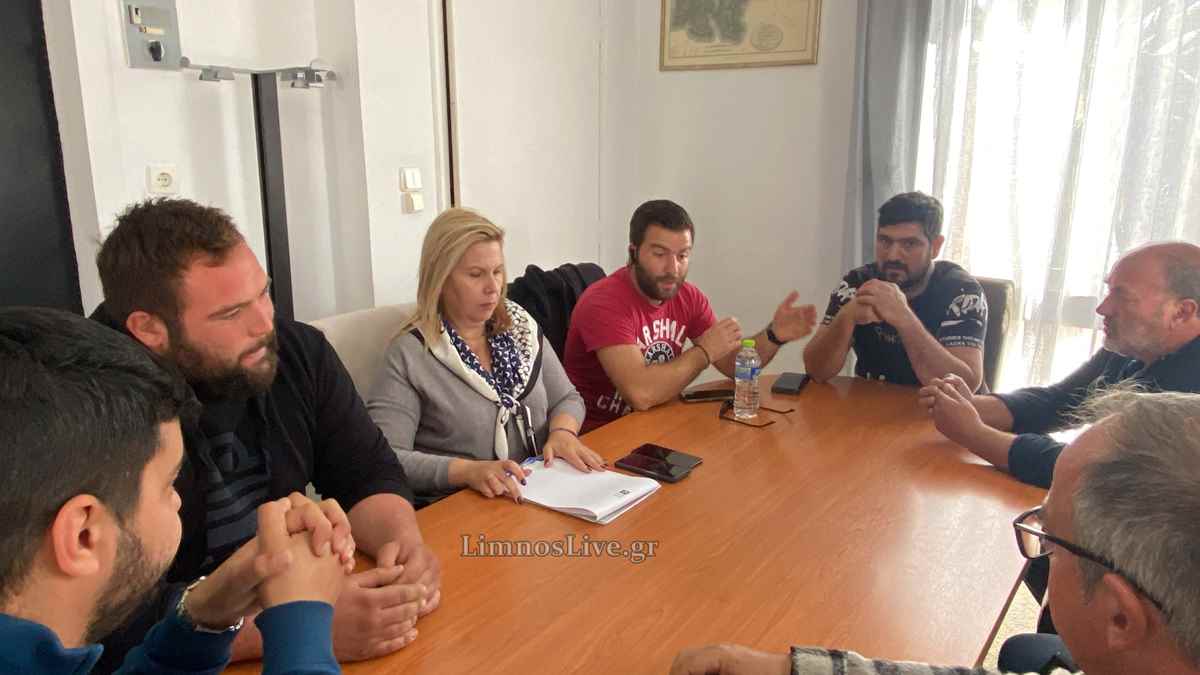 a group of people sitting around a table