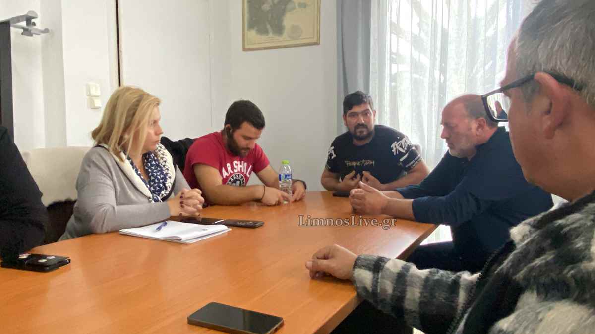 a group of people sitting around a table
