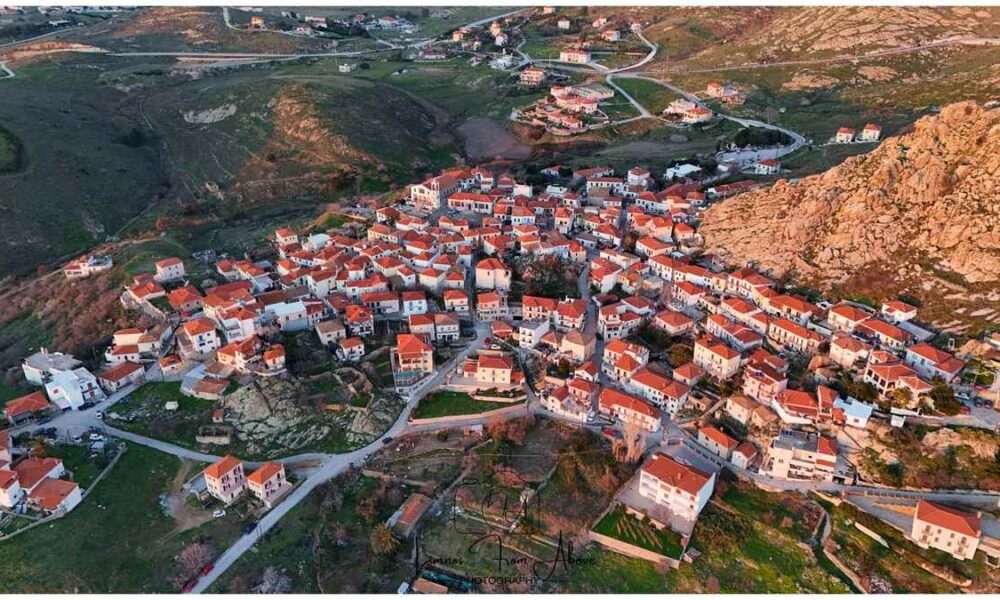 a group of houses with red roofs