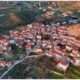 a group of houses with red roofs