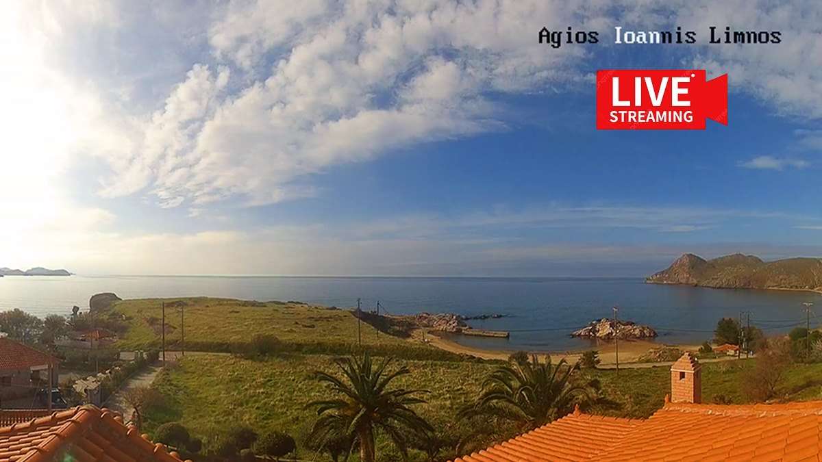 a view of a beach and grass and a building