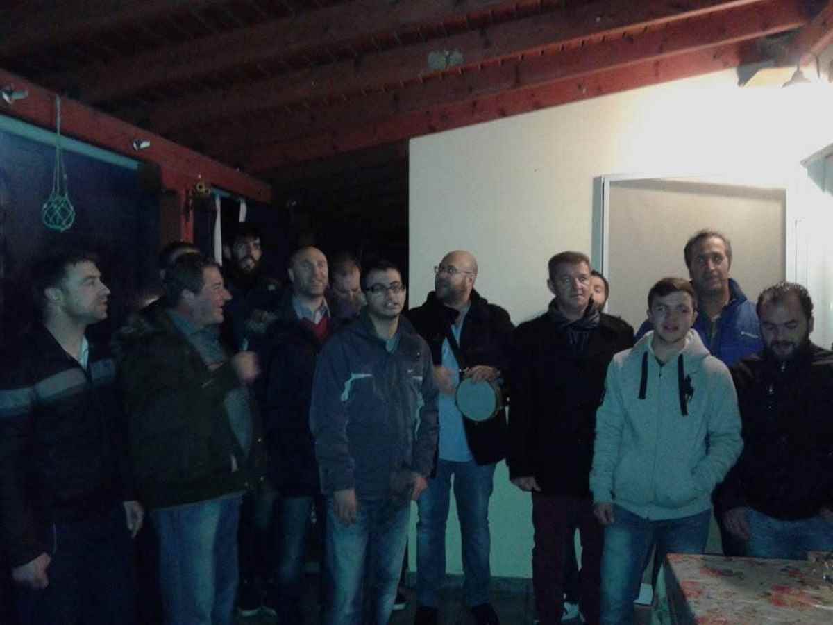 a group of people standing in a room