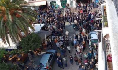 a group of people standing on a street