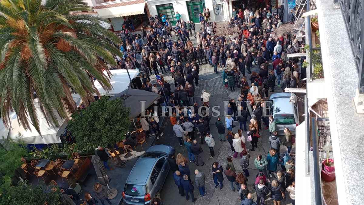 a group of people standing on a street