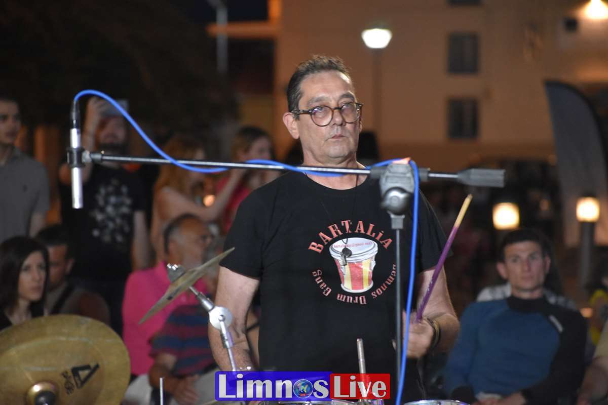 a man standing in front of a microphone