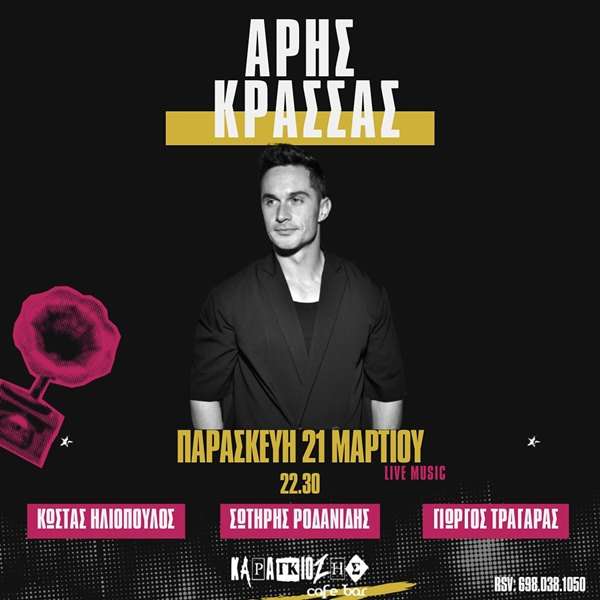 a man standing in front of a poster