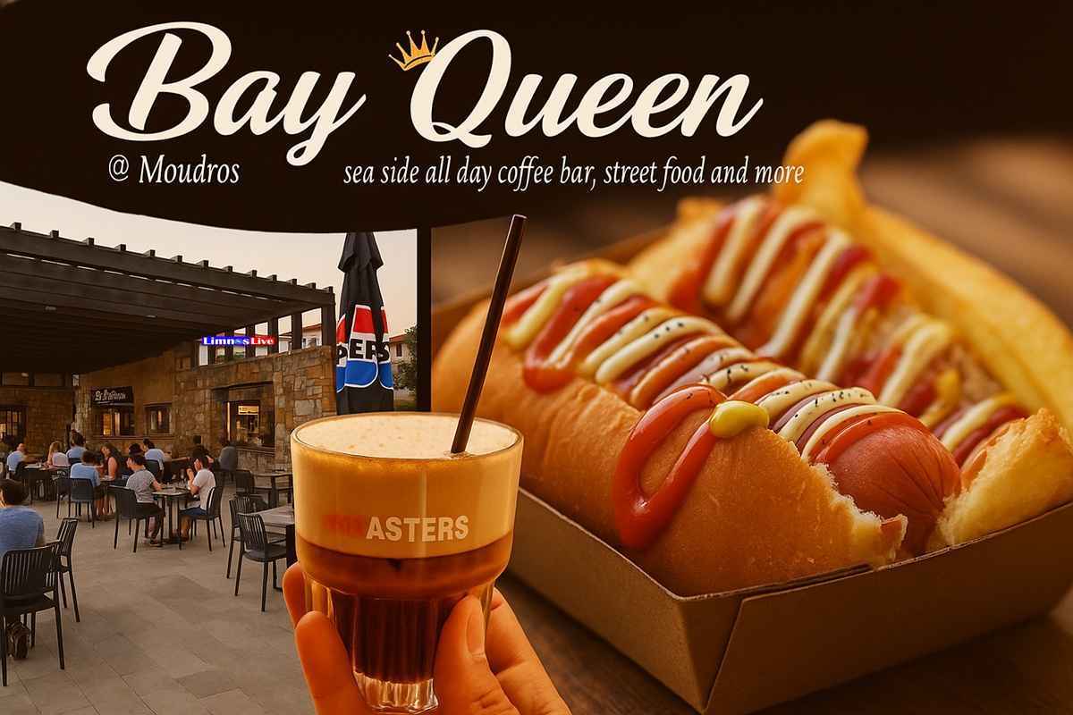 a hand holding a drink and a hot dog in a restaurant